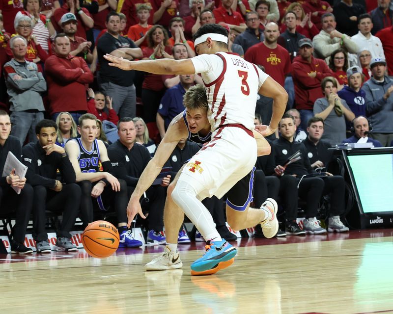 Mar 6, 2024; Ames, Iowa, USA; Iowa State Cyclones guard Tamin Lipsey (3) defends Brigham Young Cougars guard Dallin Hall (30) in the second half at James H. Hilton Coliseum. Mandatory Credit: Reese Strickland-USA TODAY Sports

