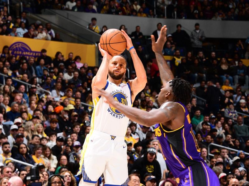 LOS ANGELES, CA - FEBRUARY 6: Stephen Curry #30 of the Golden State Warriors shoots a three point basket during the game against the Los Angeles Lakers on February 6, 2025 at Crypto.Com Arena in Los Angeles, California. NOTE TO USER: User expressly acknowledges and agrees that, by downloading and/or using this Photograph, user is consenting to the terms and conditions of the Getty Images License Agreement. Mandatory Copyright Notice: Copyright 2025 NBAE (Photo by Adam Pantozzi/NBAE via Getty Images)