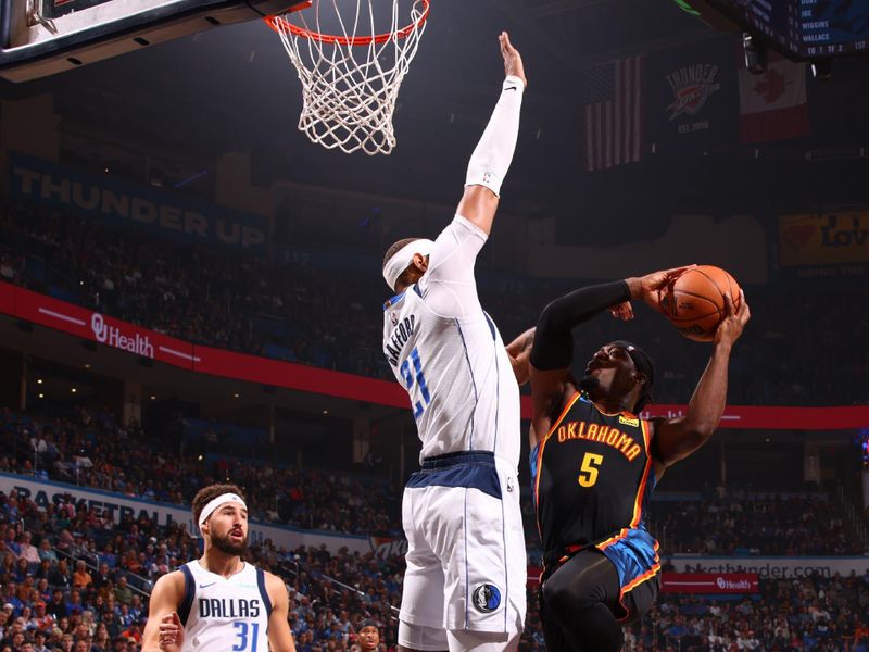 OKLAHOMA CITY, OK - NOVEMBER 17: Luguentz Dort #5 of the Oklahoma City Thunder drives to the basket during the game against the Dallas Mavericks on November 17, 2024 at Paycom Center in Oklahoma City, Oklahoma. NOTE TO USER: User expressly acknowledges and agrees that, by downloading and or using this photograph, User is consenting to the terms and conditions of the Getty Images License Agreement. Mandatory Copyright Notice: Copyright 2024 NBAE (Photo by Zach Beeker/NBAE via Getty Images)