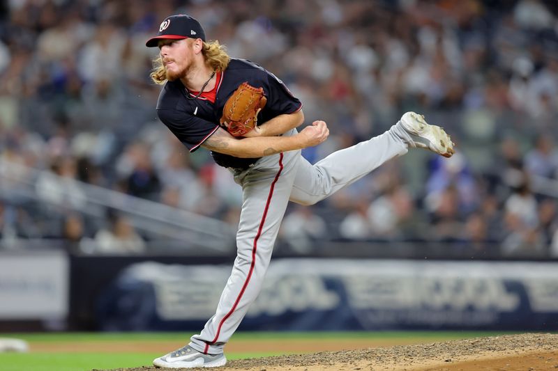 Aug 22, 2023; Bronx, New York, USA; Washington Nationals relief pitcher Mason Thompson (71) follows through on a pitch against the New York Yankees during the seventh inning at Yankee Stadium. Mandatory Credit: Brad Penner-USA TODAY Sports