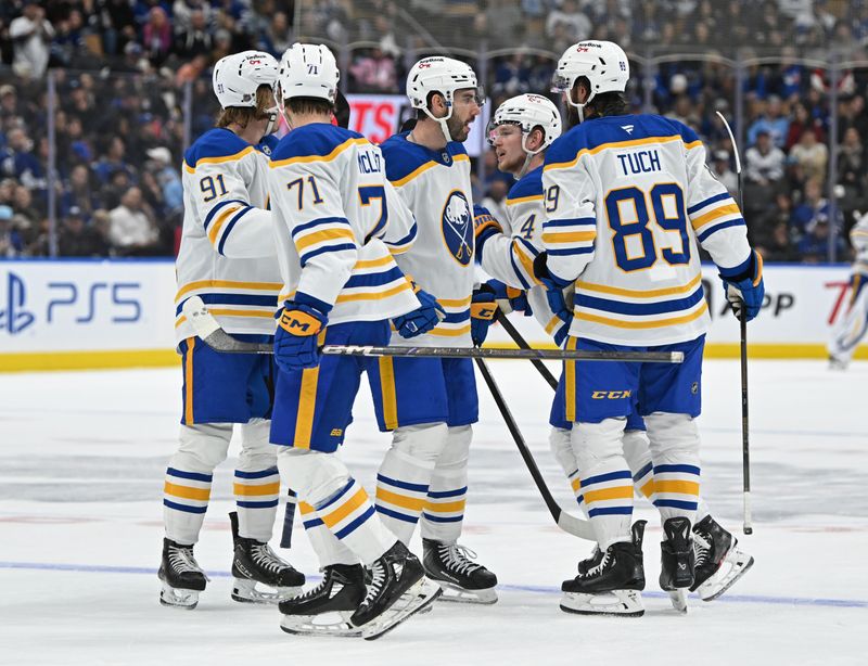 Oct 25, 2025; Toronto, Ontario, CAN; Buffalo Sabres defenceman Bowen Byram (4) celebrates a goal against the Toronto Maple Leafs in the second period at Scotiabank Arena. Mandatory Credit: Gerry Angus-Imagn Images