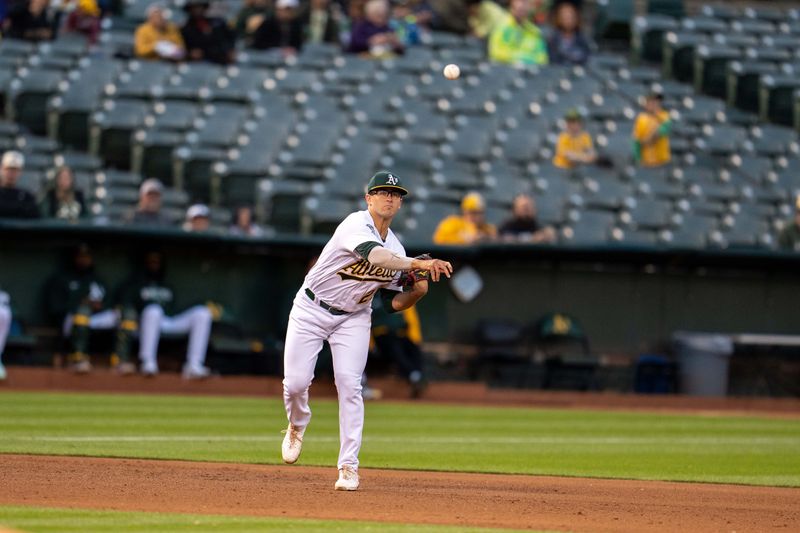 May 30, 2023; Oakland, California, USA;  Oakland Athletics third baseman Jonah Bride (26) throws out Atlanta Braves right fielder Ronald Acuna Jr. (not pictured) during the sixth inning at Oakland-Alameda County Coliseum. Mandatory Credit: Neville E. Guard-USA TODAY Sports