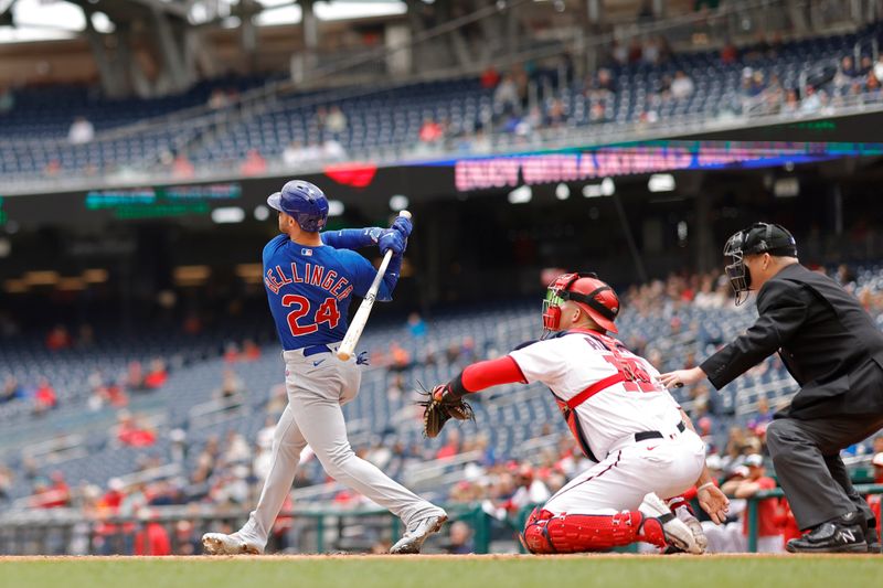 May 4, 2023; Washington, District of Columbia, USA; Chicago Cubs center fielder Cody Bellinger (24) reaches first base on an error after hitting a pop up against the Washington Nationals during the first inning a pop up at Nationals Park. Mandatory Credit: Geoff Burke-USA TODAY Sports