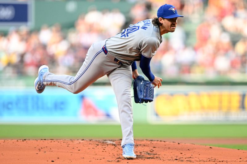 Jun 25, 2024; Boston, Massachusetts, USA; Toronto Blue Jays starting pitcher Kevin Gausman (34) pitches against the Boston Red Sox during the first inning at Fenway Park. Mandatory Credit: Brian Fluharty-USA TODAY Sports