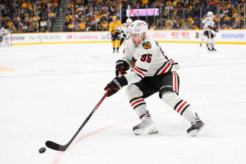 Jan 16, 2025; Nashville, Tennessee, USA;  Chicago Blackhawks right wing Ilya Mikheyev (95) skates with the puck against the Nashville Predators during the second period at Bridgestone Arena. Mandatory Credit: Steve Roberts-Imagn Images