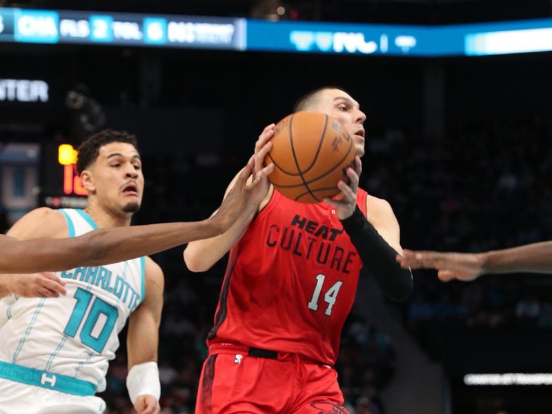 CHARLOTTE, NC - NOVEMBER 27:  Tyler Herro #14 of the Miami Heat handles the ball during the game against the Charlotte Hornets on November 27, 2024 at Spectrum Center in Charlotte, North Carolina. NOTE TO USER: User expressly acknowledges and agrees that, by downloading and or using this photograph, User is consenting to the terms and conditions of the Getty Images License Agreement. Mandatory Copyright Notice: Copyright 2024 NBAE (Photo by Brock Williams-Smith/NBAE via Getty Images)