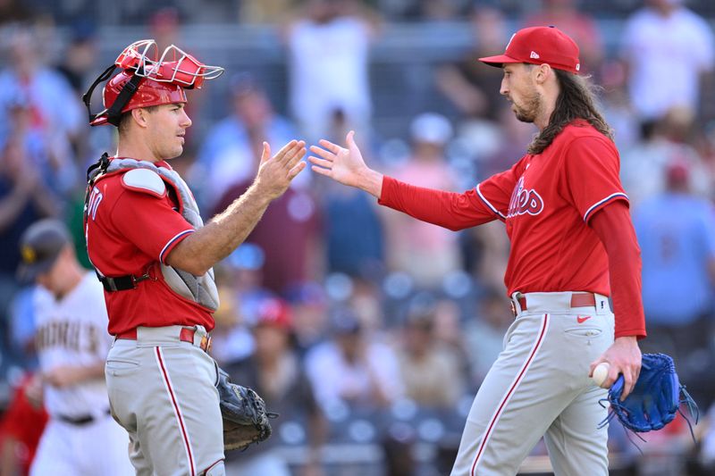 Sep 6, 2023; San Diego, California, USA; Philadelphia Phillies catcher J.T. Realmuto (10) and relief pitcher Matt Strahm (25) celebrate after defeating the San Diego Padres at Petco Park. Mandatory Credit: Orlando Ramirez-USA TODAY Sports