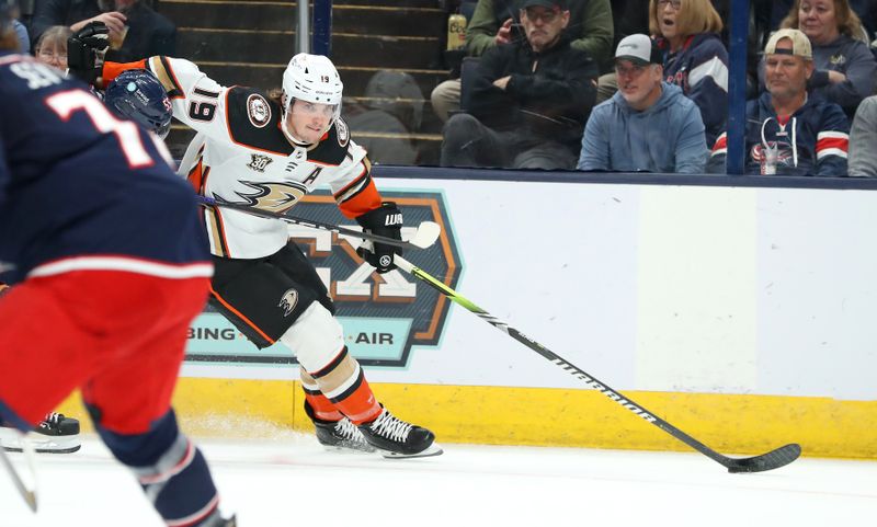 Oct 24, 2023; Columbus, Ohio, USA;  Anaheim Ducks right wing Troy Terry (19) controls the puck during the first period against the Columbus Blue Jackets at Nationwide Arena. Mandatory Credit: Joseph Maiorana-USA TODAY Sports