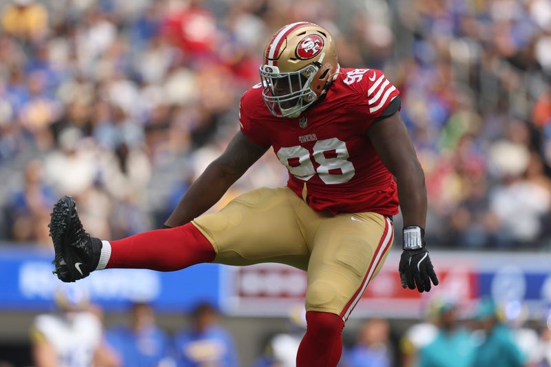 San Francisco 49ers defensive tackle Javon Hargrave (98) celebrates after sacking Los Angeles Rams quarterback Matthew Stafford during the first half of an NFL football game, Sunday, Sept. 22, 2024, in Inglewood, Calif. (AP Photo/Ryan Sun)