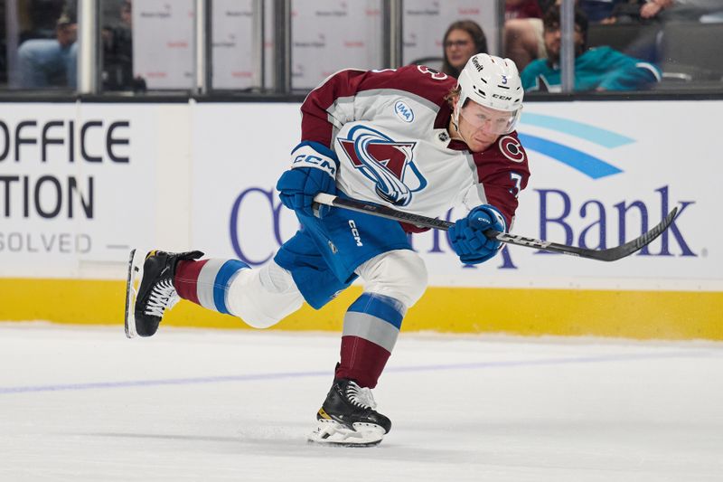 Oct 20, 2024; San Jose, California, USA; Colorado Avalanche defenseman John Ludvig (3) shoots the puck against the San Jose Sharks during the first period at SAP Center at San Jose. Mandatory Credit: Robert Edwards-Imagn Images