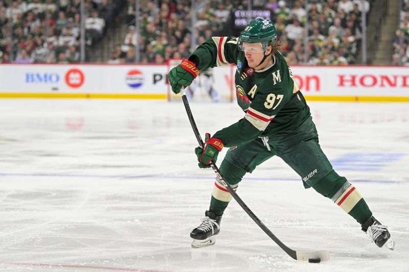 May 1, 2025; Saint Paul, Minnesota, USA;  Minnesota Wild forward Kirill Kaprizov (97) takes a shot on goal against the Vegas Golden Knights during the second period in game six of the first round of the 2025 Stanley Cup Playoffs at Xcel Energy Center. Mandatory Credit: Nick Wosika-Imagn Images