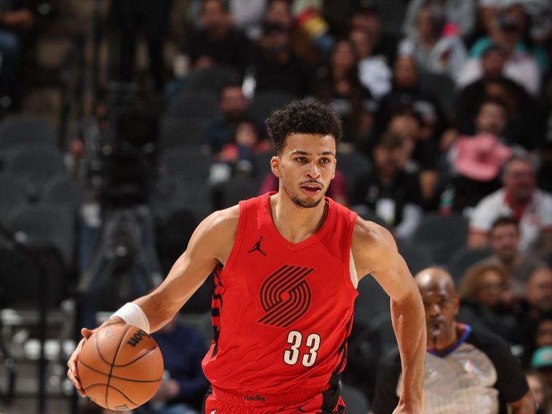 SAN ANTONIO, TX - JANUARY 26: Toumani Camara #33 of the Portland Trail Blazers dribbles the ball during the game against the San Antonio Spurs on January 6, 2024 at the Frost Bank Center in San Antonio, Texas. NOTE TO USER: User expressly acknowledges and agrees that, by downloading and or using this photograph, user is consenting to the terms and conditions of the Getty Images License Agreement. Mandatory Copyright Notice: Copyright 2024 NBAE (Photos by David Sherman/NBAE via Getty Images)