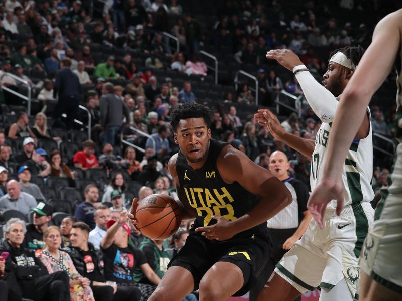 MILWAUKEE, WI - NOVEMBER 7: Brice Sensabaugh #28 of the Utah Jazz drives to the basket during the game against the Milwaukee Bucks on November 7, 2024 at Fiserv Forum Center in Milwaukee, Wisconsin. NOTE TO USER: User expressly acknowledges and agrees that, by downloading and or using this Photograph, user is consenting to the terms and conditions of the Getty Images License Agreement. Mandatory Copyright Notice: Copyright 2024 NBAE (Photo by Gary Dineen/NBAE via Getty Images).