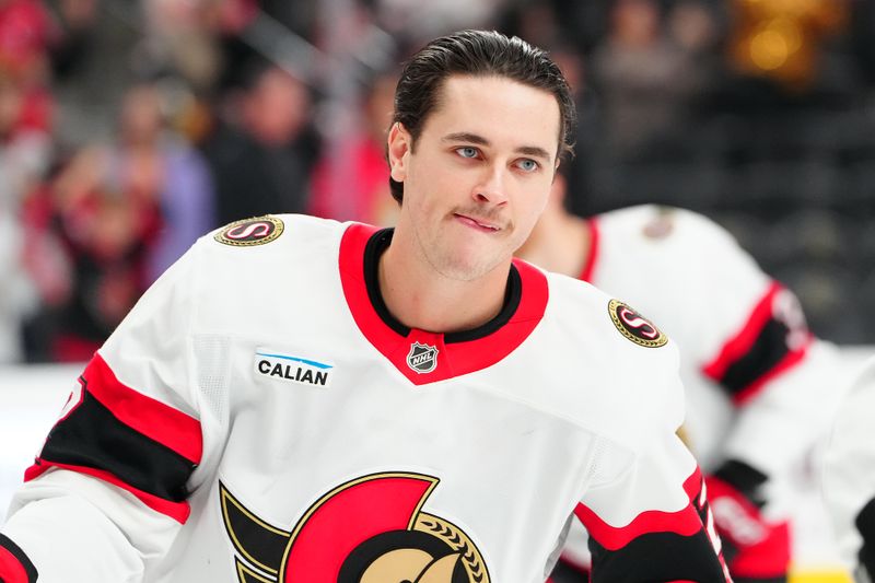 Nov 26, 2025; Las Vegas, Nevada, USA; Ottawa Senators center Shane Pinto (12) warms up before a game against the Vegas Golden Knights at T-Mobile Arena. Mandatory Credit: Stephen R. Sylvanie-Imagn Images