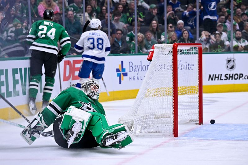 Mar 20, 2025; Dallas, Texas, USA; Tampa Bay Lightning left wing Brandon Hagel (38) scores a goal against Dallas Stars goaltender Casey DeSmith (1) during the first period at the American Airlines Center. Mandatory Credit: Jerome Miron-Imagn Images