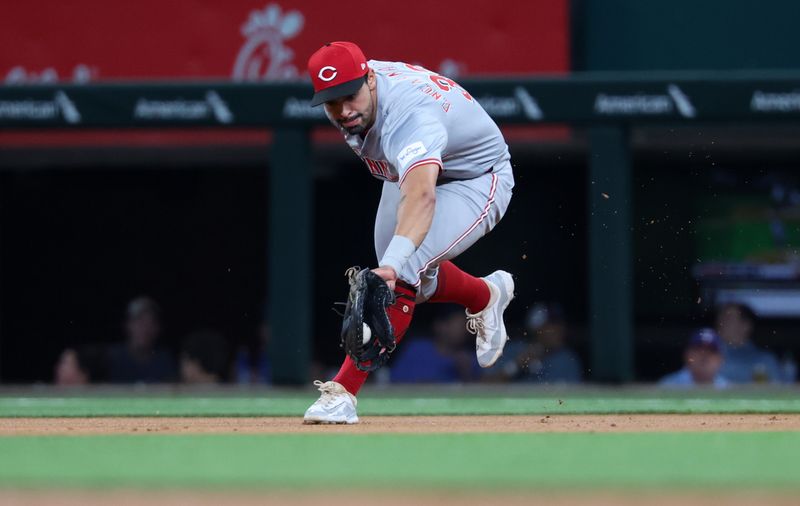 Apr 26, 2024; Arlington, Texas, USA;  Cincinnati Reds first baseman Christian Encarnacion-Strand (33) fields a ground ball during the first inning against the Texas Rangers at Globe Life Field. Mandatory Credit: Kevin Jairaj-USA TODAY Sports