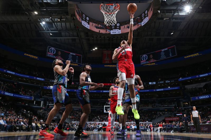 WASHINGTON, DC -? MARCH 27:  Jordan Poole #13 of the Washington Wizards shoots the ball during the game against the Brooklyn Nets on March 27, 2024 at Capital One Arena in Washington, DC. NOTE TO USER: User expressly acknowledges and agrees that, by downloading and or using this Photograph, user is consenting to the terms and conditions of the Getty Images License Agreement. Mandatory Copyright Notice: Copyright 2024 NBAE (Photo by Stephen Gosling/NBAE via Getty Images)