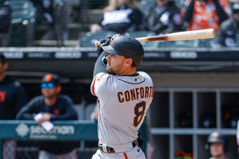 Apr 6, 2023; Chicago, Illinois, USA; San Francisco Giants right fielder Michael Conforto (8) hits a three-run home run against the Chicago White Sox during the first inning at Guaranteed Rate Field. Mandatory Credit: Kamil Krzaczynski-USA TODAY Sports