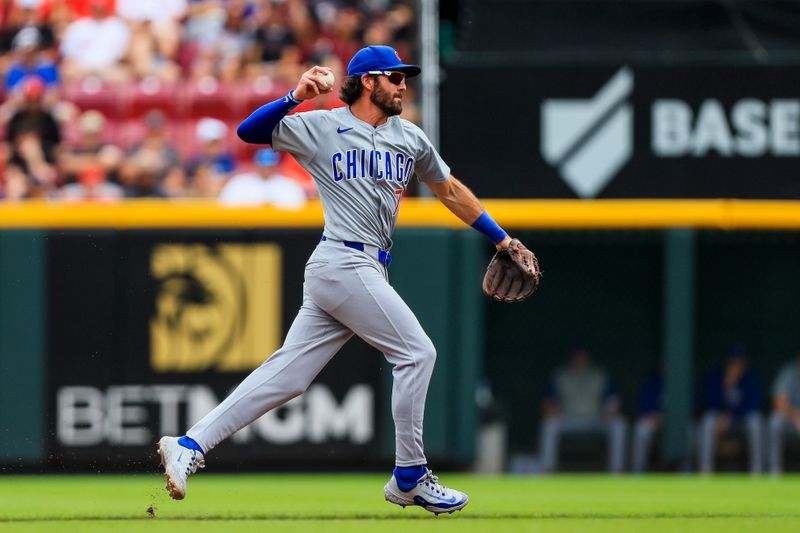 Jun 8, 2024; Cincinnati, Ohio, USA; Chicago Cubs shortstop Dansby Swanson (7) throws to first to get Cincinnati Reds outfielder TJ Friedl (not pictured) out in the first inning at Great American Ball Park. Mandatory Credit: Katie Stratman-USA TODAY Sports