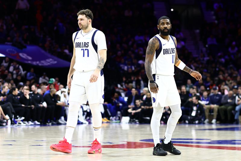 PHILADELPHIA, PENNSYLVANIA - FEBRUARY 05: Luka Doncic #77 of the Dallas Mavericks and Kyrie Irving #11 of the Dallas Mavericks look on during the fourth quarter against the Philadelphia 76ers at the Wells Fargo Center on February 05, 2024 in Philadelphia, Pennsylvania. NOTE TO USER: User expressly acknowledges and agrees that, by downloading and or using this photograph, User is consenting to the terms and conditions of the Getty Images License Agreement. (Photo by Tim Nwachukwu/Getty Images)