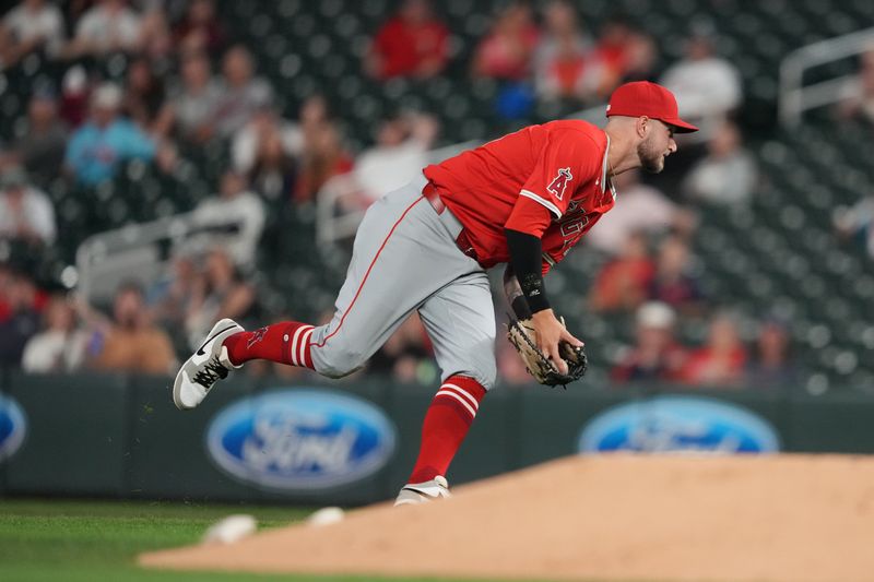 Sep 10, 2024; Minneapolis, Minnesota, USA; Los Angeles Angels first baseman Charles Leblanc (33) fields the ball during the eighth inning against the Minnesota Twins at Target Field. Mandatory Credit: Jordan Johnson-Imagn Images