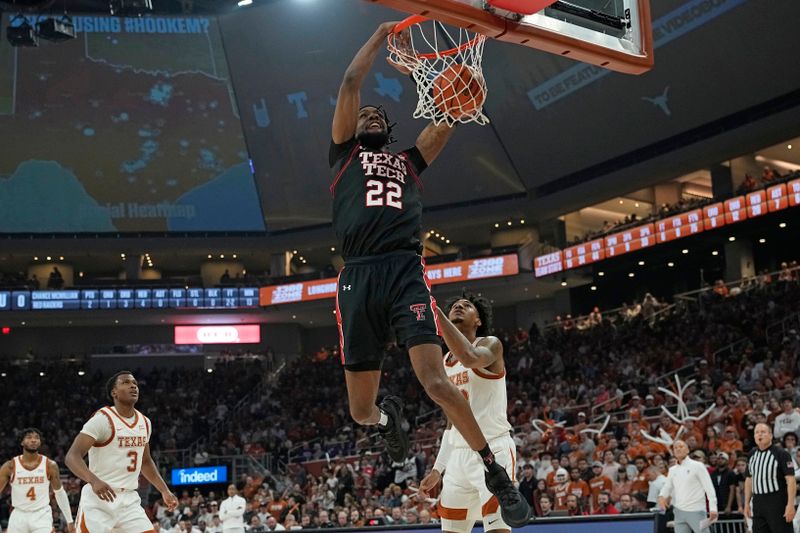 Jan 6, 2024; Austin, Texas, USA; Texas Tech Red Raiders forward Warren Washington (22) dunks over Texas Longhorns forward Dillon Mitchell (23) during the second half at Moody Center. Mandatory Credit: Scott Wachter-USA TODAY Sports