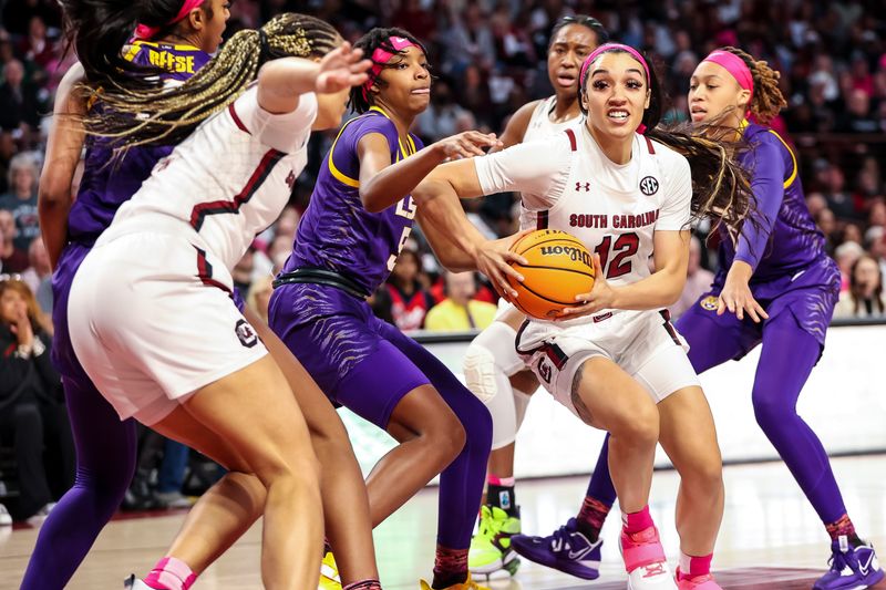 Feb 12, 2023; Columbia, South Carolina, USA; South Carolina Gamecocks guard Brea Beal (12) drives against the LSU Lady Tigers in the first half at Colonial Life Arena. Mandatory Credit: Jeff Blake-USA TODAY Sports