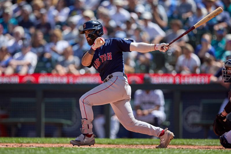 Aug 2, 2023; Seattle, Washington, USA; Boston Red Sox player Connor Wong hits a double during the fifth inning at T-Mobile Park. Mandatory Credit: John Froschauer-USA TODAY Sports