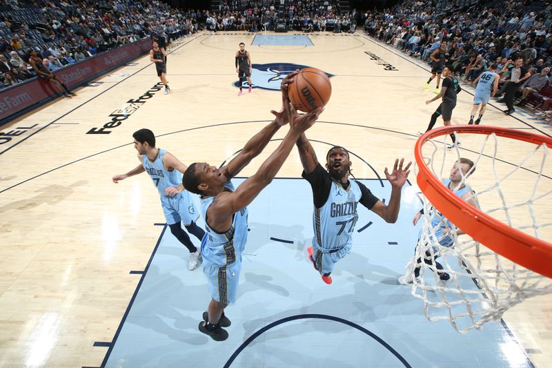 MEMPHIS, TN - MARCH 12: DeJon Jarreau #77 of the Memphis Grizzlies  grabs a rebound during the game against the Washington Wizards on March 12, 2024 at FedExForum in Memphis, Tennessee. NOTE TO USER: User expressly acknowledges and agrees that, by downloading and or using this photograph, User is consenting to the terms and conditions of the Getty Images License Agreement. Mandatory Copyright Notice: Copyright 2024 NBAE (Photo by Joe Murphy/NBAE via Getty Images)