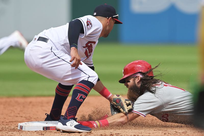 Jul 23, 2023; Cleveland, Ohio, USA; Philadelphia Phillies center fielder Brandon Marsh (16) is caught stealing by Cleveland Guardians second baseman Andres Gimenez (0) during the sixth inning at Progressive Field. Mandatory Credit: Ken Blaze-USA TODAY Sports