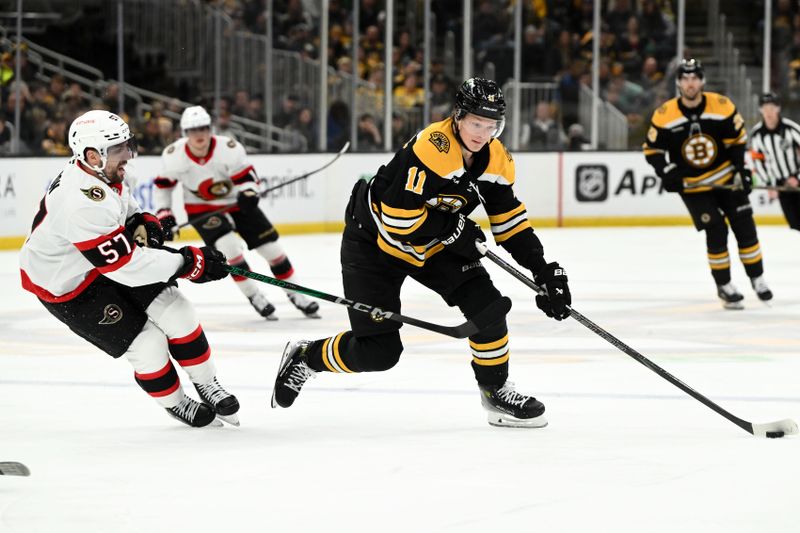 Jan 23, 2025; Boston, Massachusetts, USA; Boston Bruins center Trent Frederic (11) skates against the Ottawa Senators during the third period at the TD Garden. Mandatory Credit: Brian Fluharty-Imagn Images