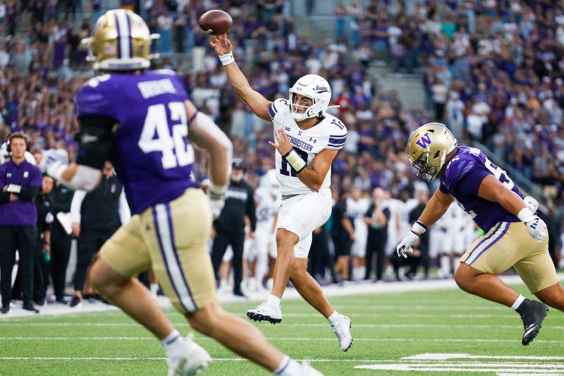 Sep 21, 2024; Seattle, Washington, USA; Northwestern Wildcats quarterback Jack Lausch (12) passes against the Washington Huskies during the fourth quarter at Alaska Airlines Field at Husky Stadium. Mandatory Credit: Joe Nicholson-Imagn Images