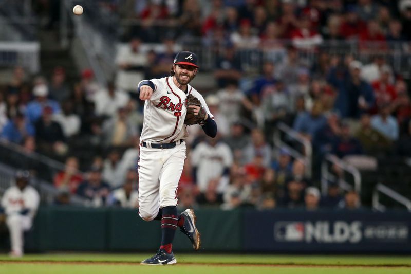 Oct 12, 2022; Atlanta, Georgia, USA; Atlanta Braves shortstop Dansby Swanson (7) fields the ball and throws out Philadelphia Phillies right fielder Nick Castellanos (8) at first base in the seventh inning during game two of the NLDS for the 2022 MLB Playoffs at Truist Park. Mandatory Credit: Brett Davis-USA TODAY Sports