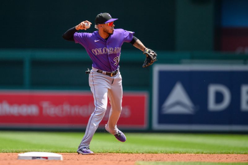 Jul 26, 2023; Washington, District of Columbia, USA; Colorado Rockies second baseman Harold Castro (30) throws to first base during the first inning against the Washington Nationals at Nationals Park. Mandatory Credit: Reggie Hildred-USA TODAY Sports