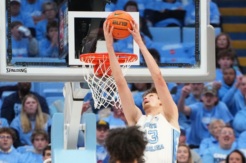 Feb 23, 2026; Chapel Hill, North Carolina, USA; North Carolina Tar Heels center Henri Veesaar (13) scores in the first half at Dean E. Smith Center. Mandatory Credit: Bob Donnan-Imagn Images
