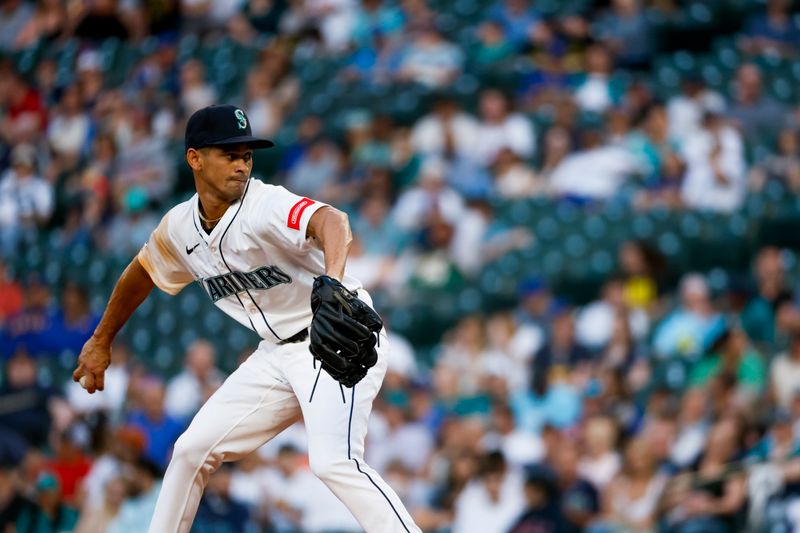 May 28, 2025; Seattle, Washington, USA; Seattle Mariners relief pitcher Las Cantano (62) throws against the Washington Nationals during the seventh inning at T-Mobile Park. Mandatory Credit: Joe Nicholson-Imagn Images