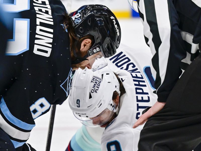 Jan 17, 2026; Salt Lake City, Utah, USA; Utah Mammoth center Kevin Stenlund (82) and Seattle Kraken center Chandler Stephenson (9) face off during first period at Delta Center. Mandatory Credit: Peter Creveling-Imagn Images