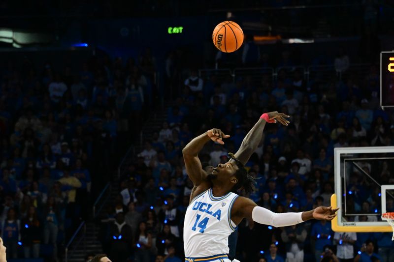 Mar 4, 2023; Los Angeles, California, USA;  UCLA Bruins forward Kenneth Nwuba (14) goes for the ball during the first half against Arizona Wildcats at Pauley Pavilion presented by Wescom. Mandatory Credit: Richard Mackson-USA TODAY Sports