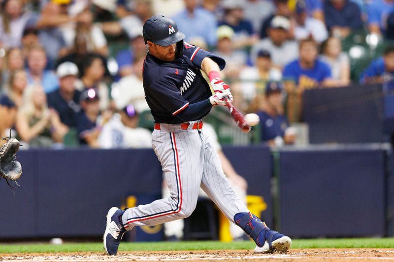 Aug 22, 2023; Milwaukee, Wisconsin, USA;  Minnesota Twins left fielder Jordan Luplow (16) hits a double during the fourth inning against the Milwaukee Brewers at American Family Field. Mandatory Credit: Jeff Hanisch-USA TODAY Sports