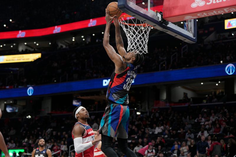 WASHINGTON, DC - MARCH 27: Nic Claxton #33 of the Brooklyn Nets dunks backwards during the first half against the Washington Wizards at Capital One Arena on March 27, 2024 in Washington, DC. NOTE TO USER: User expressly acknowledges and agrees that, by downloading and or using this photograph, User is consenting to the terms and conditions of the Getty Images License Agreement. (Photo by Jess Rapfogel/Getty Images)