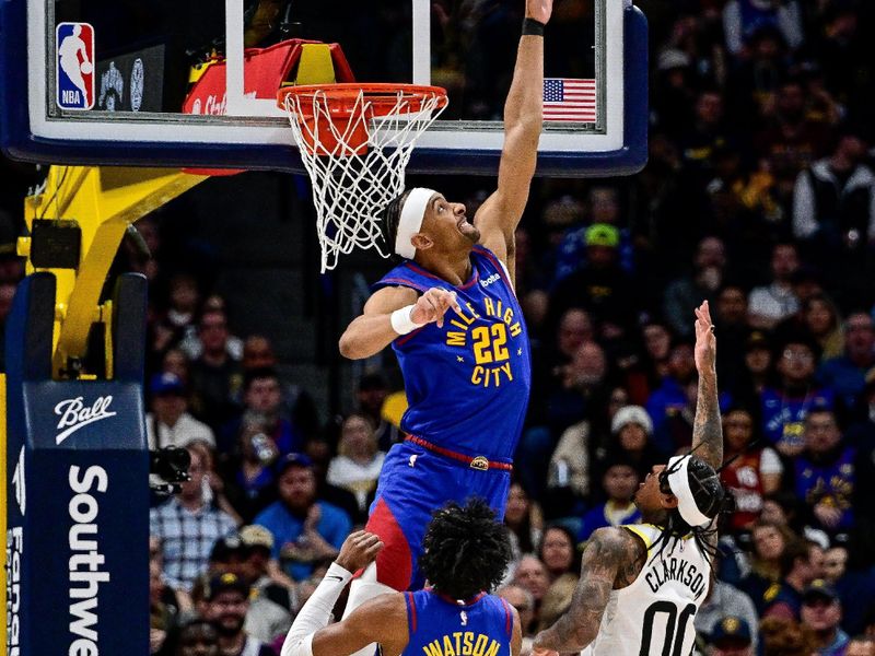 DENVER, COLORADO - MARCH 9: Zeke Nnaji #22 of the Denver Nuggets defends a shot attempt by Jordan Clarkson #00 of the Utah Jazz in the first half of a game at Ball Arena on March 9, 2024 in Denver, Colorado. (Photo by Dustin Bradford/Getty Images)