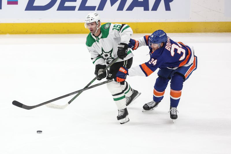 Mar 26, 2026; Elmont, New York, USA; Dallas Stars center Colin Blackwell (15) and New York Islanders defenseman Adam Boqvist (34) battle for control of the puck in the first period at UBS Arena. Mandatory Credit: Wendell Cruz-Imagn Images Mar 26, 2026; Elmont, New York, USA; Dallas Stars center Colin Blackwell (15) and New York Islanders defenseman Adam Boqvist (34) battle for control of the puck in the first period at UBS Arena. Mandatory Credit: Wendell Cruz-Imagn Images