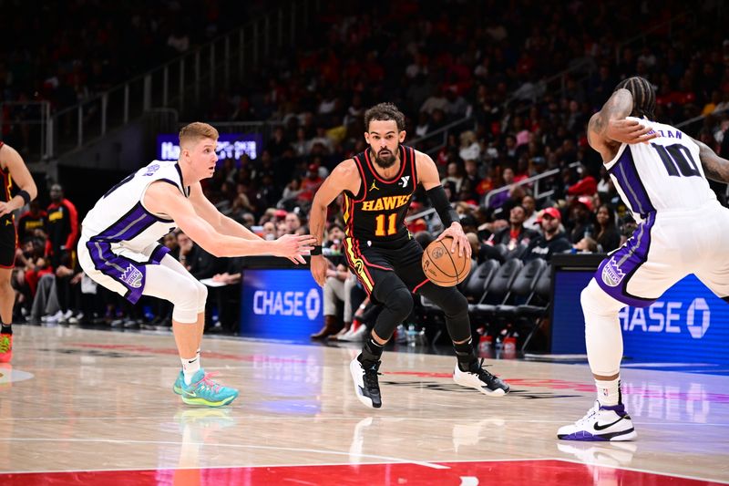 ATLANTA, GA - NOVEMBER 1: Trae Young #11 of the Atlanta Hawks handles the ball during the game against the Sacramento Kings on November 1, 2024 at State Farm Arena in Atlanta, Georgia.  NOTE TO USER: User expressly acknowledges and agrees that, by downloading and/or using this Photograph, user is consenting to the terms and conditions of the Getty Images License Agreement. Mandatory Copyright Notice: Copyright 2024 NBAE (Photo by Adam Hagy/NBAE via Getty Images)