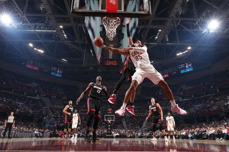 CLEVELAND, OH - NOVEMBER 20: Isaac Okoro #35 of the Cleveland Cavaliers drives to the basket during the game against the Miami Heat on November 20, 2022 at Rocket Mortgage Fieldhouse in Cleveland, Ohio. NOTE TO USER: User expressly acknowledges and agrees that, by downloading and or using this photograph, User is consenting to the terms and conditions of the Getty Images License Agreement. Mandatory Copyright Notice: Copyright 2022 NBAE (Photo by Joe Murphy/NBAE via Getty Images)