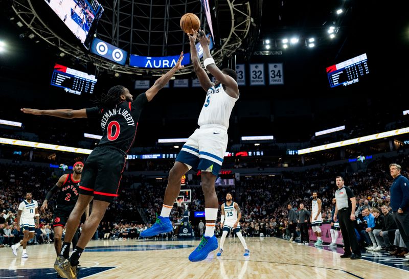 MINNEAPOLIS, MINNESOTA - APRIL 3: Anthony Edwards #5 of the Minnesota Timberwolves shoots the ball over defender Javon Freeman-Liberty #0 of the Toronto Raptors in the third quarter of the game at Target Center on April 3, 2024 in Minneapolis, Minnesota. NOTE TO USER: User expressly acknowledges and agrees that, by downloading and or using this photograph, User is consenting to the terms and conditions of the Getty Images License Agreement. (Photo by Stephen Maturen/Getty Images)