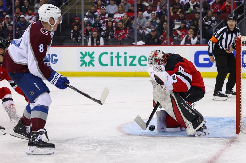 Feb 6, 2024; Newark, New Jersey, USA; New Jersey Devils goaltender Vitek Vanecek (41) makes a save on Colorado Avalanche defenseman Cale Makar (8) during the third period at Prudential Center. Mandatory Credit: Ed Mulholland-USA TODAY Sports