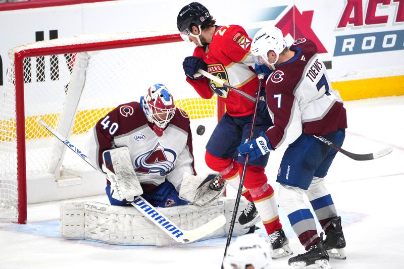 Nov 23, 2024; Sunrise, Florida, USA;  Colorado Avalanche goaltender Alexandar Georgiev (40) makes a save against the Florida Panthers in the third period at Amerant Bank Arena. Mandatory Credit: Jim Rassol-Imagn Images