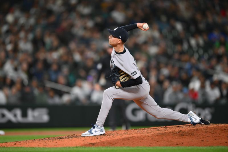 May 13, 2025; Seattle, Washington, USA; New York Yankees relief pitcher Luke Weaver (30) pitches to the Seattle Mariners during the eighth inning at T-Mobile Park. Mandatory Credit: Steven Bisig-Imagn Images