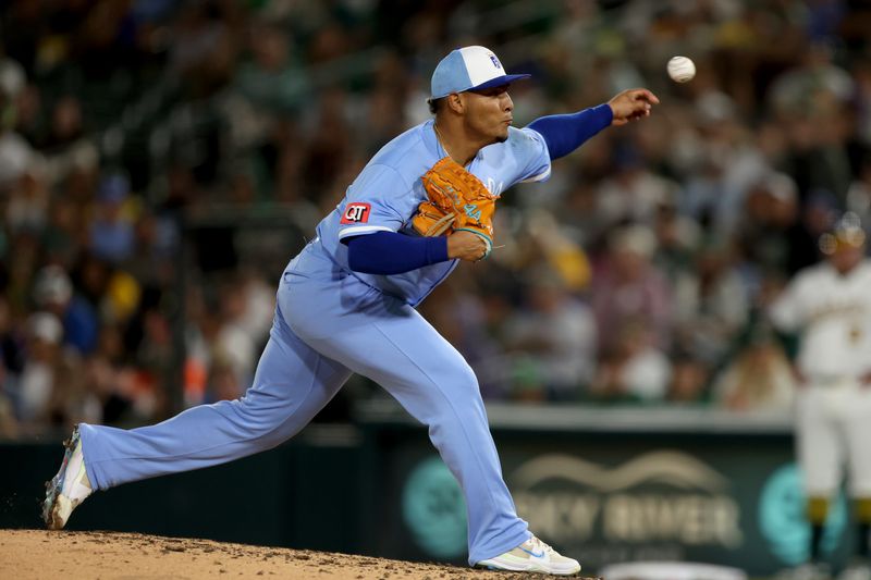 Sep 27, 2025; West Sacramento, California, USA; Kansas City Royals pitcher Angel Zerpa (61) throws a pitch against the Athletics during the seventh inning at Sutter Health Park. Mandatory Credit: Dennis Lee-Imagn Images