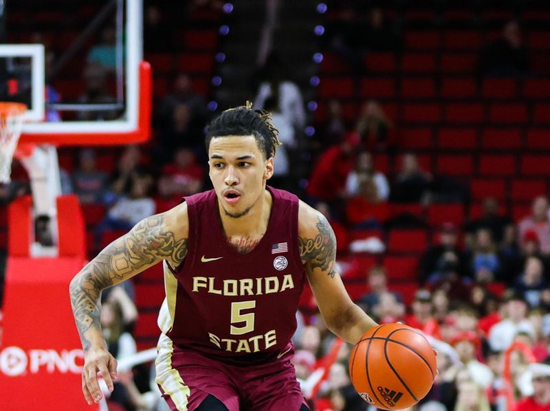 Feb 1, 2023; Raleigh, North Carolina, USA; Florida State Seminoles forward De'Ante Green (5) dribbles during the second half against North Carolina State Wolfpack at PNC Arena.  Mandatory Credit: Jaylynn Nash-USA TODAY Sports